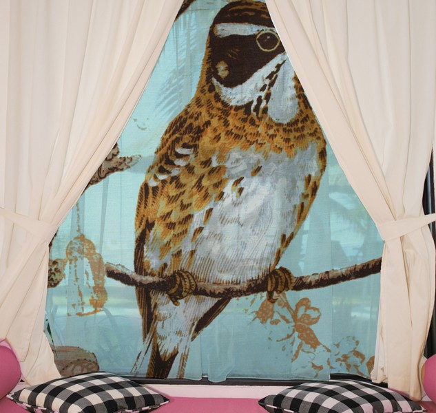 Looking at a gazebo and the beach from a hotel room