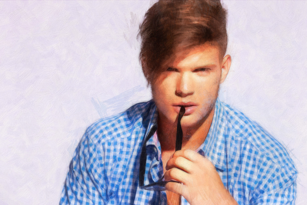 pensive male fashion model chewing his glasses and looking at the camera